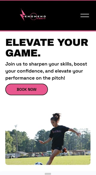 Female soccer player kicking ball on field during training session